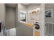 Convenient laundry room featuring a washer, dryer, and shelving for storage at 626 Windermere Blvd # 4D, Charleston, SC 29407
