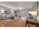 Open living room and dining area with natural light and hardwood floors at 626 Windermere Blvd # 4D, Charleston, SC 29407