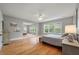 Bright main bedroom featuring hardwood floors, light grey walls, a large mirror, and lots of natural light at 626 Windermere Blvd # 4D, Charleston, SC 29407