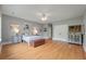 Spacious main bedroom features hardwood floors, light grey walls, and ample natural light at 626 Windermere Blvd # 4D, Charleston, SC 29407