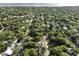 Aerial view of a neighborhood with mature trees, glimpses of houses, and proximity to the bay at 755 Adluh St, Mount Pleasant, SC 29464