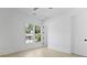 A bright bedroom features hardwood floors and a large window for ample natural light at 755 Adluh St, Mount Pleasant, SC 29464