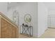 Hallway with decorative table, mirror, and custom built-in storage cabinets with light hardwood flooring at 755 Adluh St, Mount Pleasant, SC 29464