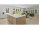 Open-concept kitchen and dining area featuring a large island and seamless flow to the living spaces at 755 Adluh St, Mount Pleasant, SC 29464