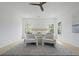 This spacious main bedroom features a ceiling fan, two chairs and lots of natural light from the surrounding windows at 755 Adluh St, Mount Pleasant, SC 29464