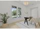 Bright office space with modern black desk, decorative lighting, and views of the outdoors at 755 Adluh St, Mount Pleasant, SC 29464