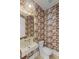 Powder room featuring designer wallpaper, modern sink and fixtures, and vanity mirror at 755 Adluh St, Mount Pleasant, SC 29464