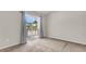 Comfortable bedroom with a view of the water that features neutral walls, carpet flooring, and a sliding glass door to a balcony at 7838 Nummie Ct, North Charleston, SC 29418