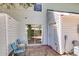 Cozy patio featuring a sliding glass door, white trim, and a charming seating area for relaxation at 7838 Nummie Ct, North Charleston, SC 29418