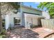 Private brick patio with sliding glass door access to the home's interior, perfect for outdoor relaxation at 7838 Nummie Ct, North Charleston, SC 29418