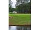 Open green field with a baseball backstop, perfect for recreational activities by the water at 7850 Wilderness Trl # 6A, North Charleston, SC 29418