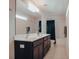 Bright bathroom featuring a double vanity, large mirror and neutral color palette at 7850 Wilderness Trl # 6A, North Charleston, SC 29418