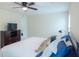 Comfortable bedroom featuring a large bed, ceiling fan, and a dark wood dresser at 7850 Wilderness Trl # 6A, North Charleston, SC 29418