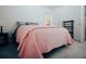 Cozy bedroom view features a bright pink comforter and a door leading to another room at 7850 Wilderness Trl # 6A, North Charleston, SC 29418