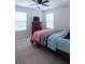 Cozy bedroom with plush carpet, bright windows, and modern ceiling fan, perfect for relaxing after a long day at 7850 Wilderness Trl # 6A, North Charleston, SC 29418