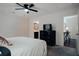 Bedroom view showcasing a dresser, TV, bathroom access and stylish decor at 7850 Wilderness Trl # 6A, North Charleston, SC 29418