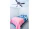 Cozy bedroom with a soft pink comforter and a modern ceiling fan at 7850 Wilderness Trl # 6A, North Charleston, SC 29418