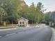 Community entrance featuring a staffed guard house with security gate at 7850 Wilderness Trl # 6A, North Charleston, SC 29418