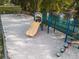 Charming playground with a slide and swings surrounded by sand at 7850 Wilderness Trl # 6A, North Charleston, SC 29418