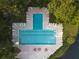 Aerial view of community pool with lounge chairs and lush landscaping, perfect for relaxation and recreation at 7850 Wilderness Trl # 6A, North Charleston, SC 29418