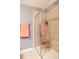 Modern shower featuring tiled walls, glass doors, and a built-in bench at 7850 Wilderness Trl # 6A, North Charleston, SC 29418