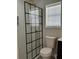 Bathroom with a glass shower enclosure, patterned tile, and a gold shower head at 804 Temple Rd # B, Ladson, SC 29456