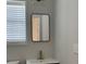 Bathroom vanity with neutral colors, modern mirror, and updated fixtures at 804 Temple Rd # B, Ladson, SC 29456