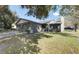 Traditional brick home with mature trees, lush lawn, and attached two-car garage at 804 Temple Rd # B, Ladson, SC 29456
