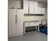 Garage with custom storage cabinets, work bench, and epoxy floor at 804 Temple Rd # B, Ladson, SC 29456