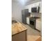 Updated kitchen features stainless steel appliances, tile flooring, and butcher block countertops at 804 Temple Rd # B, Ladson, SC 29456