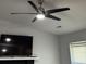 Living room featuring a sleek black ceiling fan, bright natural light, and television at 804 Temple Rd # B, Ladson, SC 29456