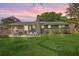 Expansive backyard with patio, featuring a well-maintained lawn and stylish outdoor seating area for entertaining at 816 Farnham Rd, Charleston, SC 29412