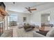 Cozy living room featuring a brick fireplace and seamless views to a well-appointed dining area at 816 Farnham Rd, Charleston, SC 29412