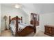 Bedroom featuring carpeted floors, decorative trim, and a spacious closet at 8651 Grassy Oaks Trl, North Charleston, SC 29420