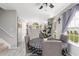 Well-lit dining area with modern table set, gray walls, and view of open kitchen at 8651 Grassy Oaks Trl, North Charleston, SC 29420