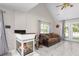 Inviting living room featuring a modern fireplace, comfortable seating, and french doors to backyard at 8651 Grassy Oaks Trl, North Charleston, SC 29420