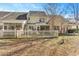 Well-maintained backyard with privacy fence, patio, and mature trees for a tranquil outdoor space at 8653 Grassy Oak Trl, North Charleston, SC 29420