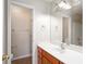 Well-maintained bathroom featuring a spacious vanity, mirror, and combination tub-shower at 8653 Grassy Oak Trl, North Charleston, SC 29420