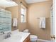 Well-lit bathroom with a single vanity, standard shower/tub, and a window for natural light at 8653 Grassy Oak Trl, North Charleston, SC 29420