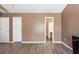 Large bedroom featuring durable floors with access to an adjacent bathroom and multiple closets at 8653 Grassy Oak Trl, North Charleston, SC 29420
