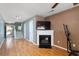 Bright living room showing hardwood floors, fireplace and modern fixtures at 8653 Grassy Oak Trl, North Charleston, SC 29420