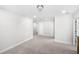 Spacious bedroom featuring neutral carpet, white walls, and multiple entry doors at 8654 Windsor Hill Blvd, North Charleston, SC 29420