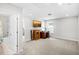 Versatile room with carpet, TV, desk, and access to the bathroom at 8654 Windsor Hill Blvd, North Charleston, SC 29420