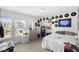 Bright bedroom with a large window and neon sign at 8654 Windsor Hill Blvd, North Charleston, SC 29420