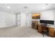 Carpeted room with TV, desk, and multiple access doors at 8654 Windsor Hill Blvd, North Charleston, SC 29420
