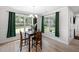 Bright dining area with large windows and stylish chandelier at 8654 Windsor Hill Blvd, North Charleston, SC 29420