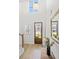Bright foyer with wood floors, a staircase, a transom window, and a decorative mirror at 8654 Windsor Hill Blvd, North Charleston, SC 29420