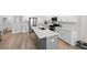 Well-lit kitchen island with stainless steel appliances and ample counter space at 8654 Windsor Hill Blvd, North Charleston, SC 29420