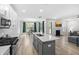 Spacious kitchen island flows into dining area and living room with fireplace at 8654 Windsor Hill Blvd, North Charleston, SC 29420