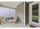 View of a screened-in patio with neutral furniture and a view to the outdoor at 8654 Windsor Hill Blvd, North Charleston, SC 29420